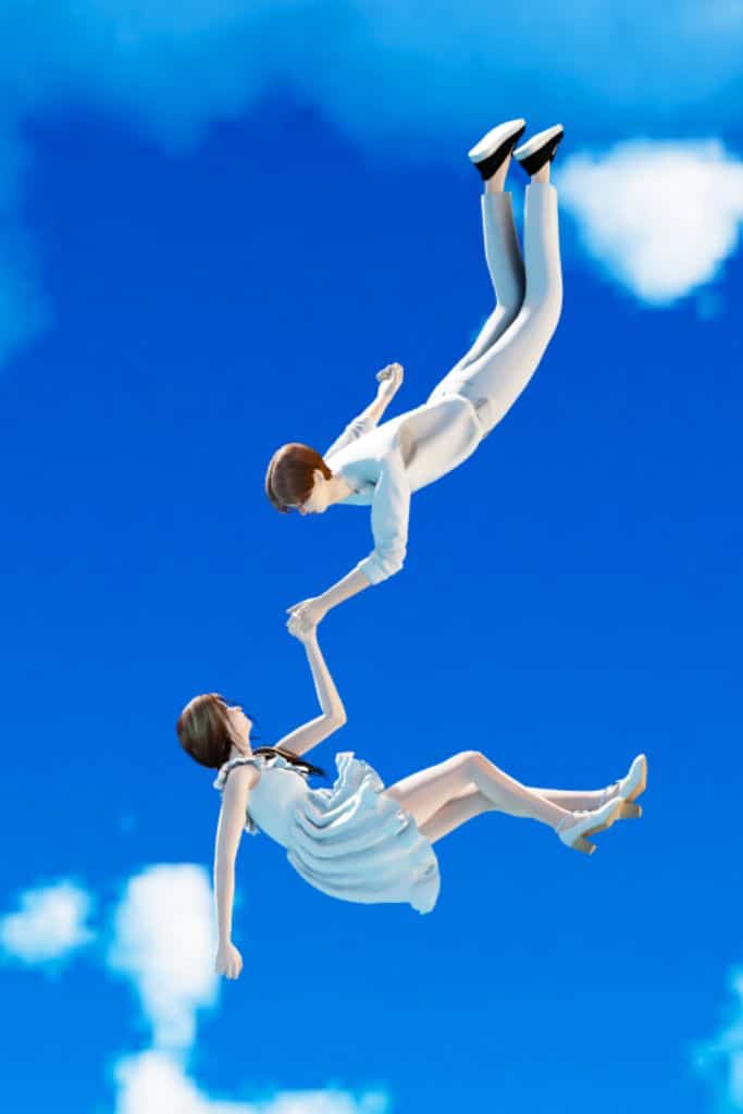 sim couple holding each other while falling