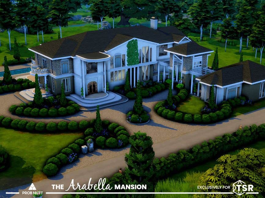large white mansion surrounded by shrubs