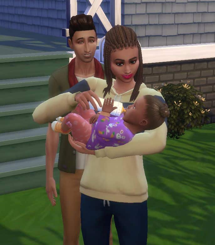 sim couple feeding their infant
