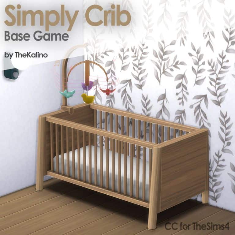 wooden crib with bird mobile