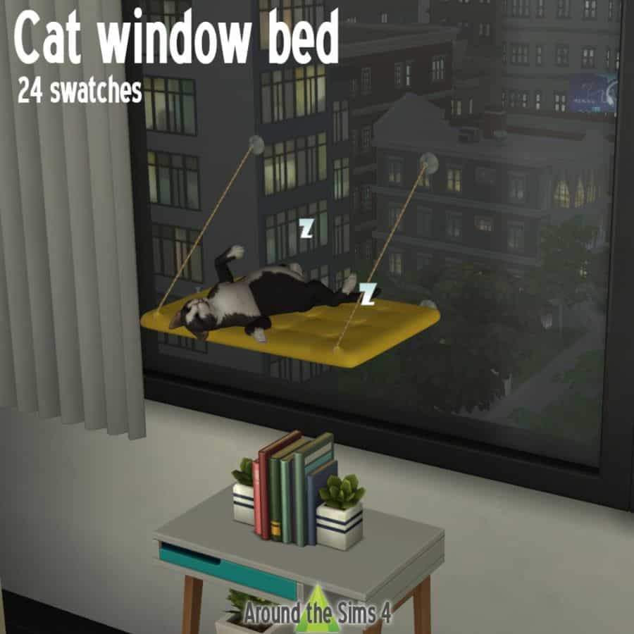 cat resting on bed hanging from window