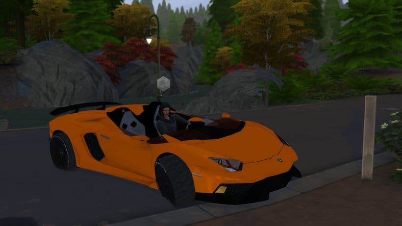 sim driving orange lamborghini