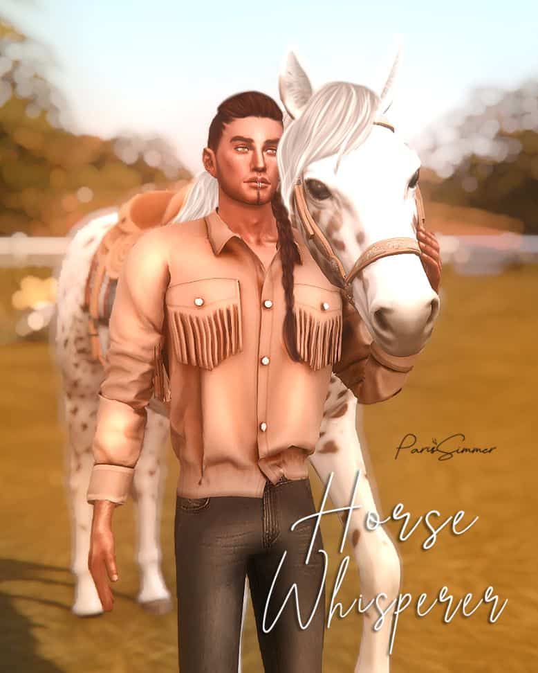 male horse whisperer leaning on his horse