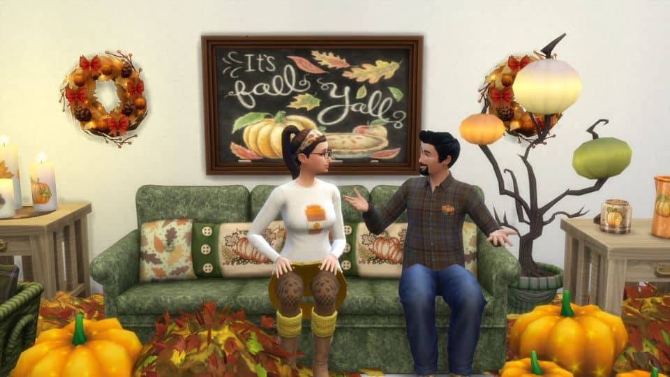 sims sitting in their autumn decorated living room
