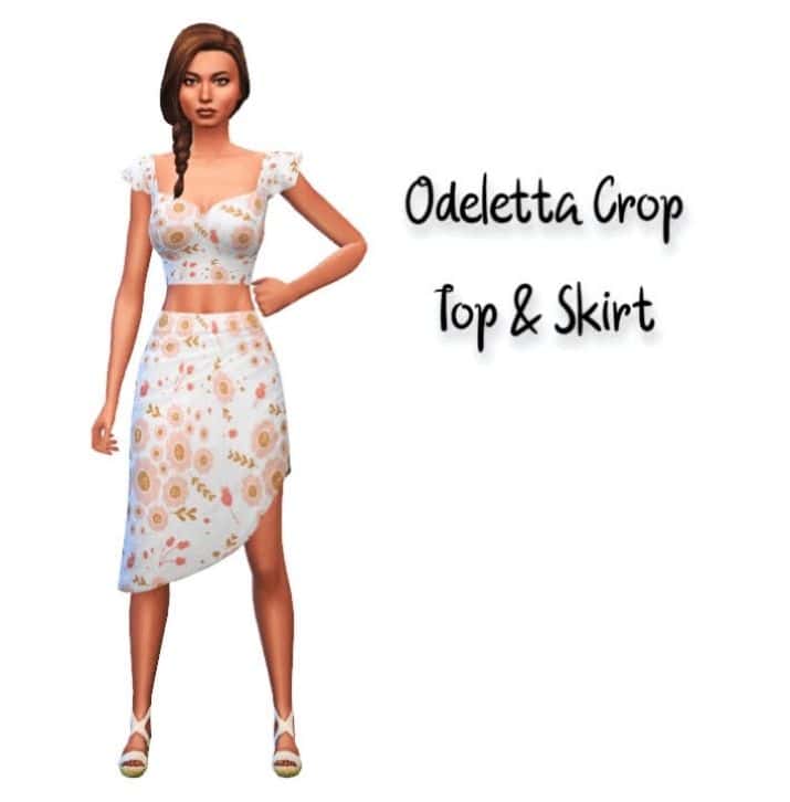 female sim wearing a floral crop top and skirt