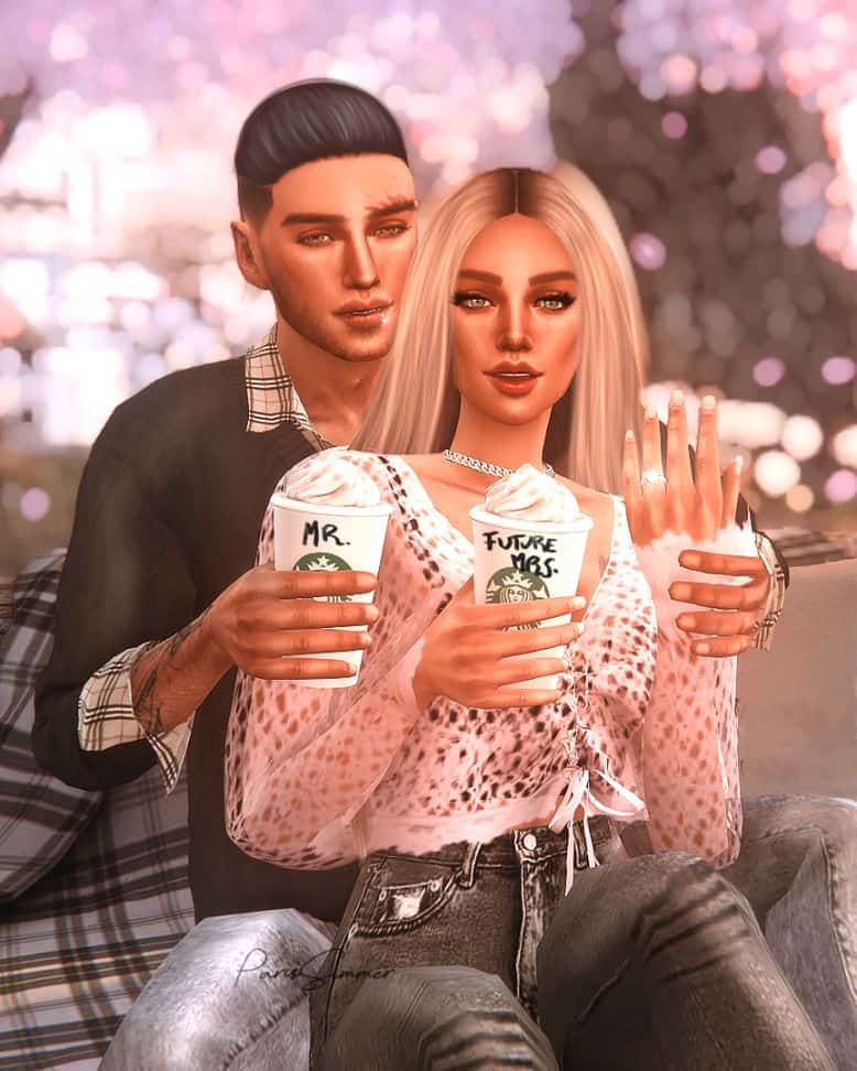sim with fiance showing engagement ring