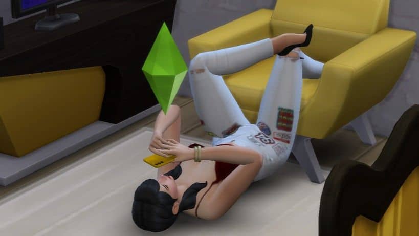 sim lying on floor while on phone