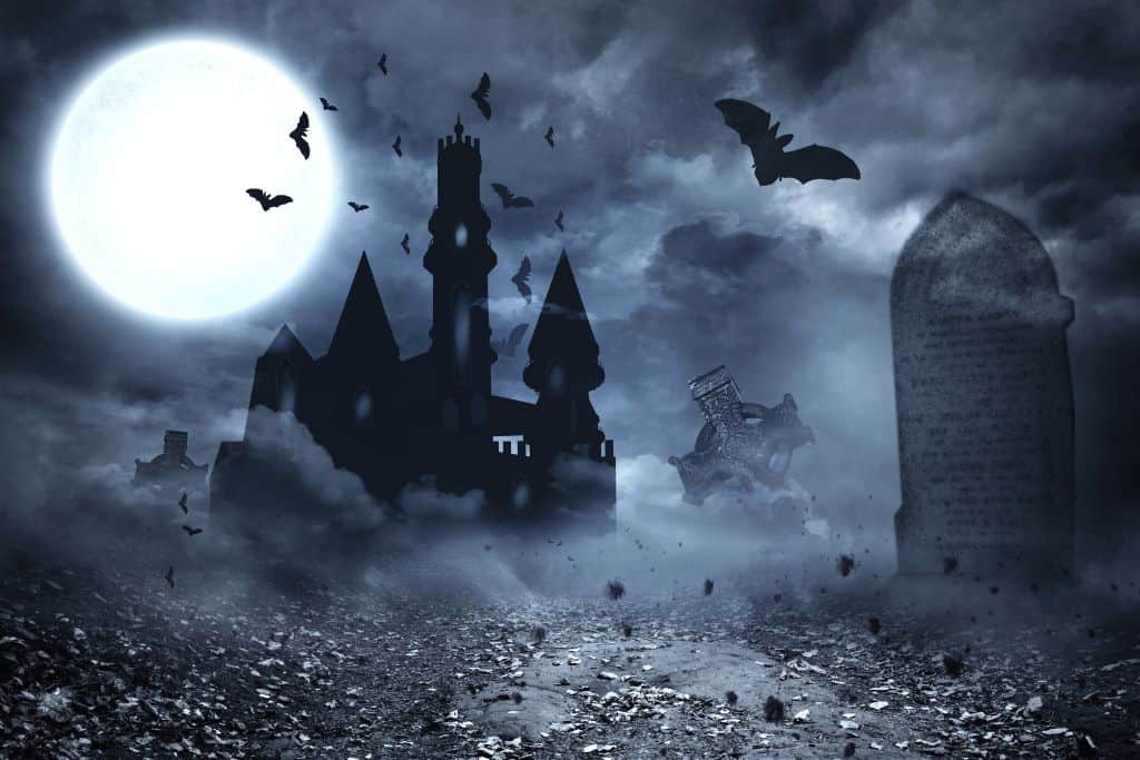 bats flying over a vampire's castle