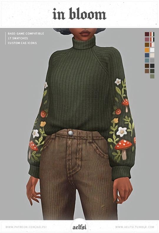 dark green sweater with flowers down arms
