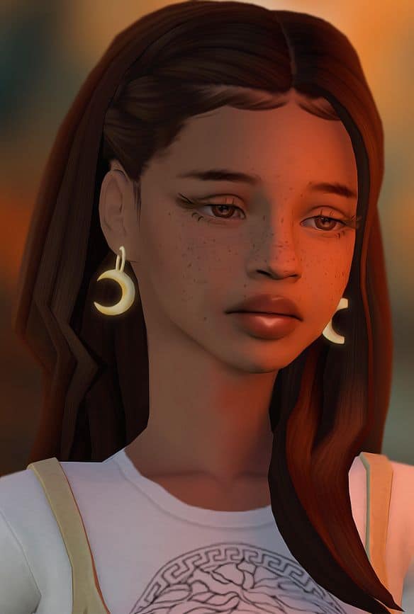 female sim wearing moon earrings
