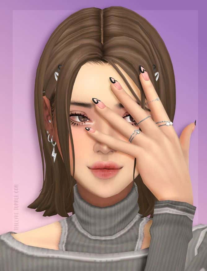 a female sim with a hand in front of her face with heart nail designs