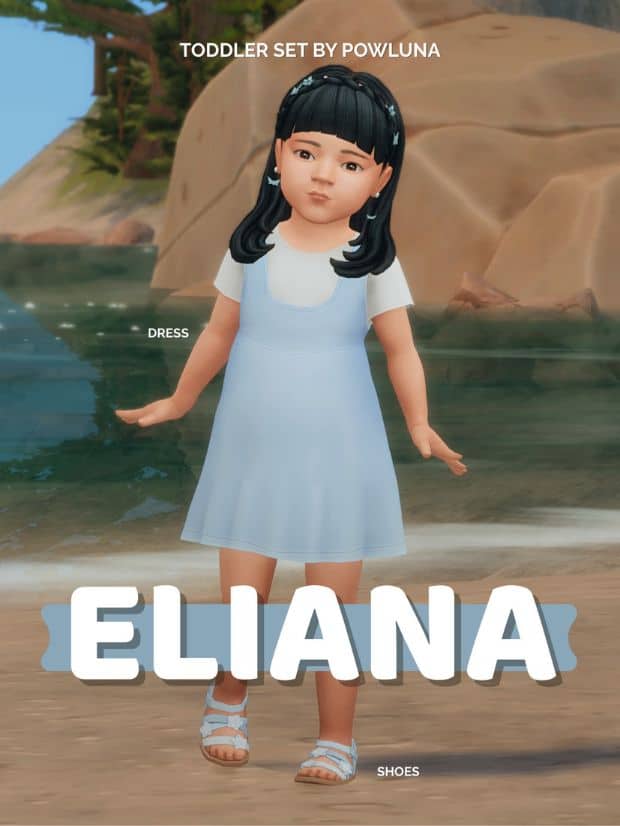 female toddler wearing a light blue dress and sandals