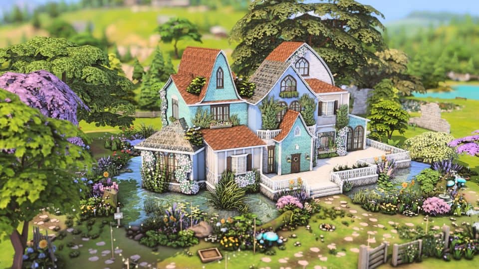 a light blue two tier fairy mansion with light brown roof