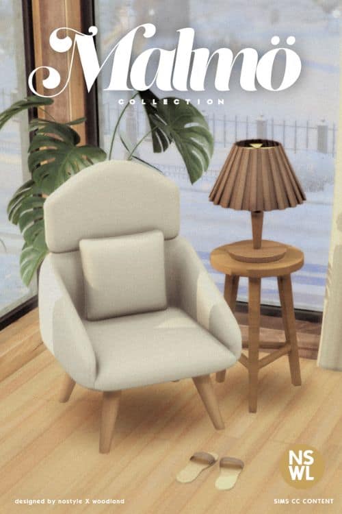 a living room chair, end table, lamp and slippers