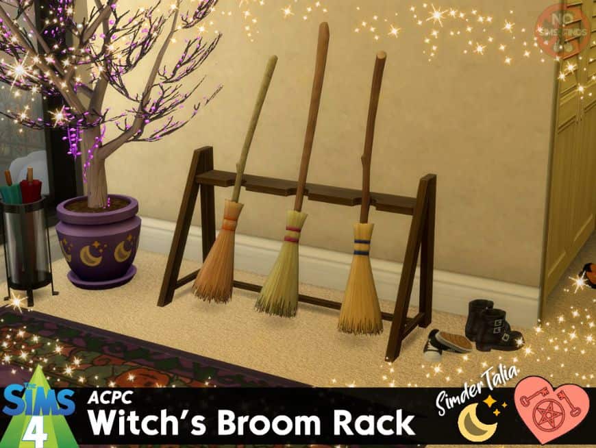 three witch's broom sticks on a rack