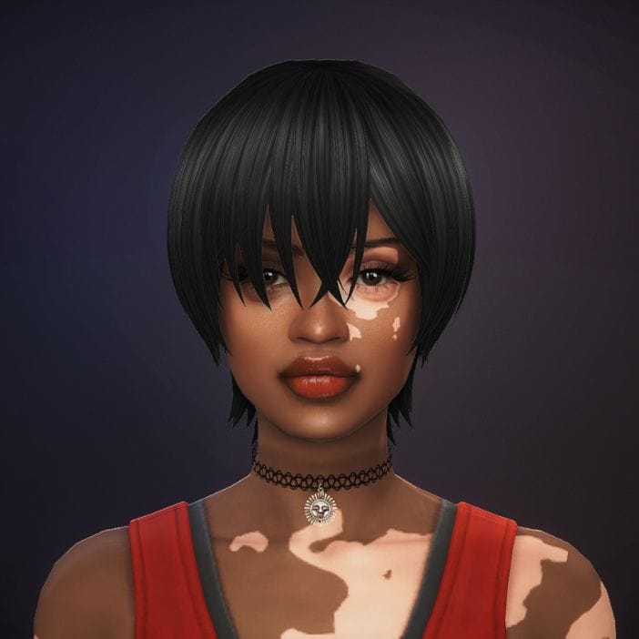 female with a short, straight hairstyle with a long bangs falling past the eyes