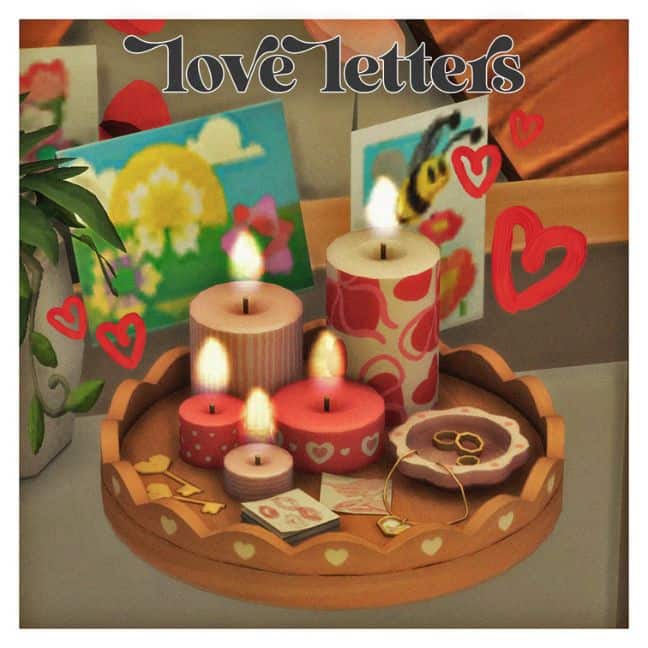 love letters placed on a table with candles