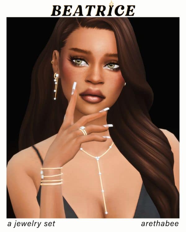 female sim wearing matching earrings, a long necklace, bracelet and ring