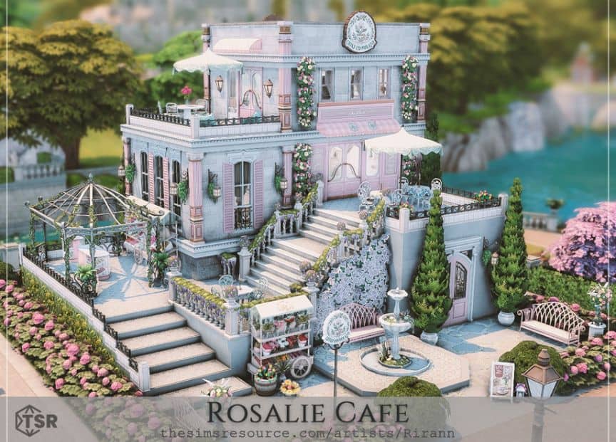 a white and light pink cafe build with an outdoor garden
