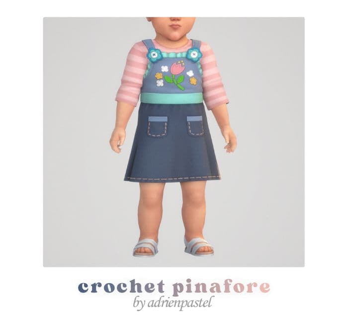 infant sim with a pinafore with crochet details