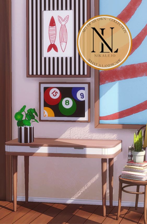 two modern prints on a wall above a small table